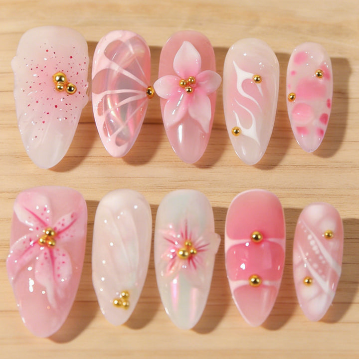 Artificial nails with floral designs and glitter accents Bowlift