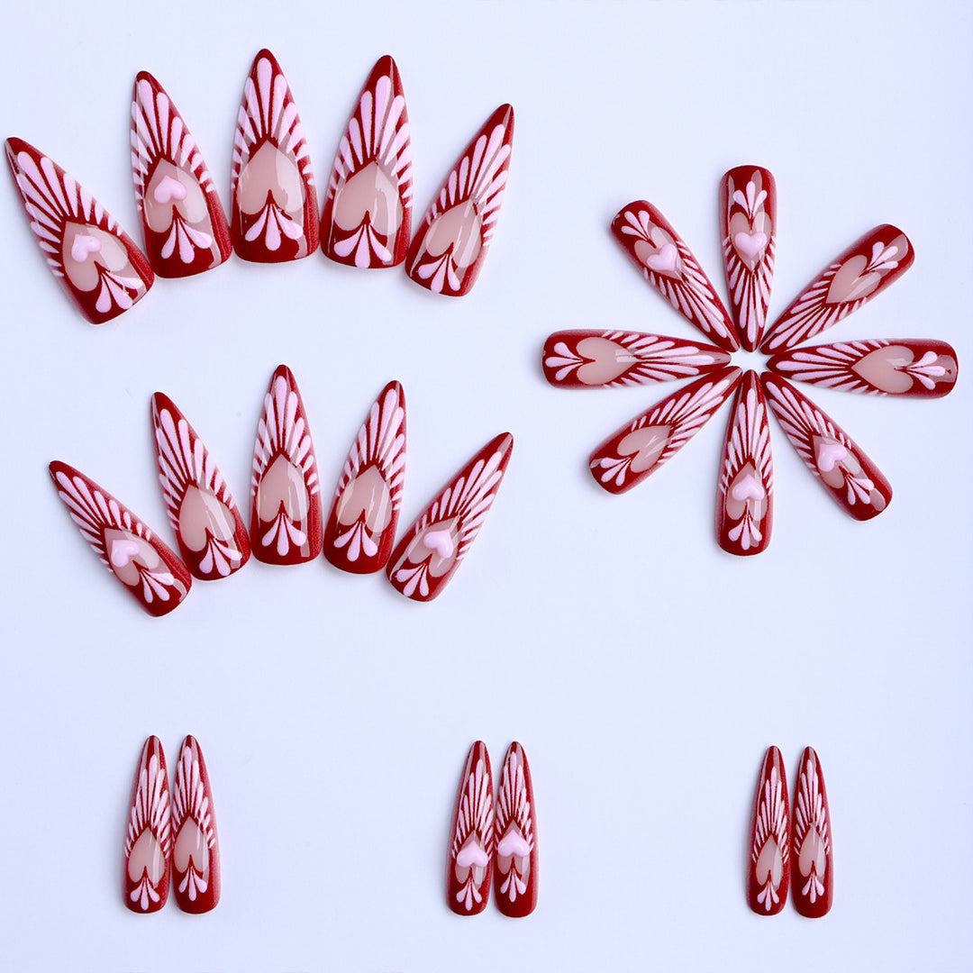 Artificial nails with playful heart design and elegant accents Bowlift