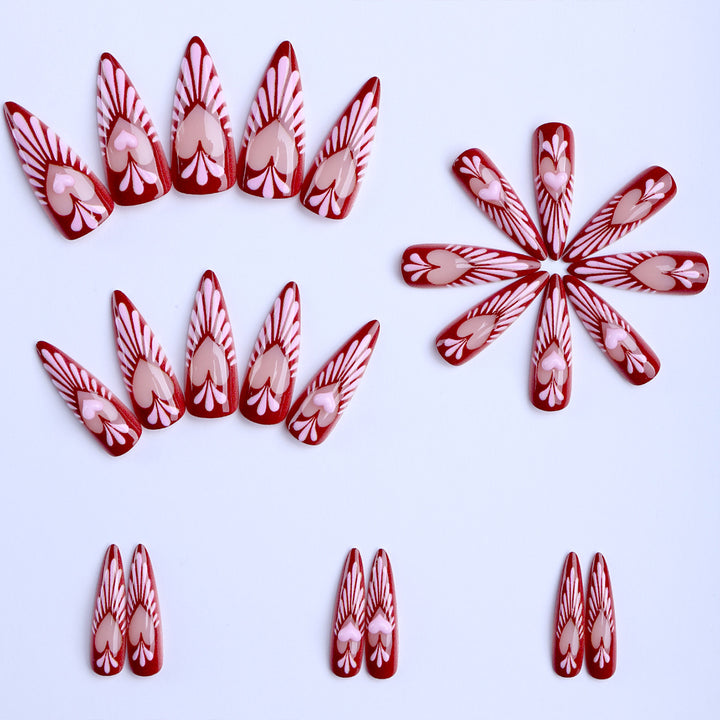 Artificial nails with playful heart design and elegant accents Bowlift