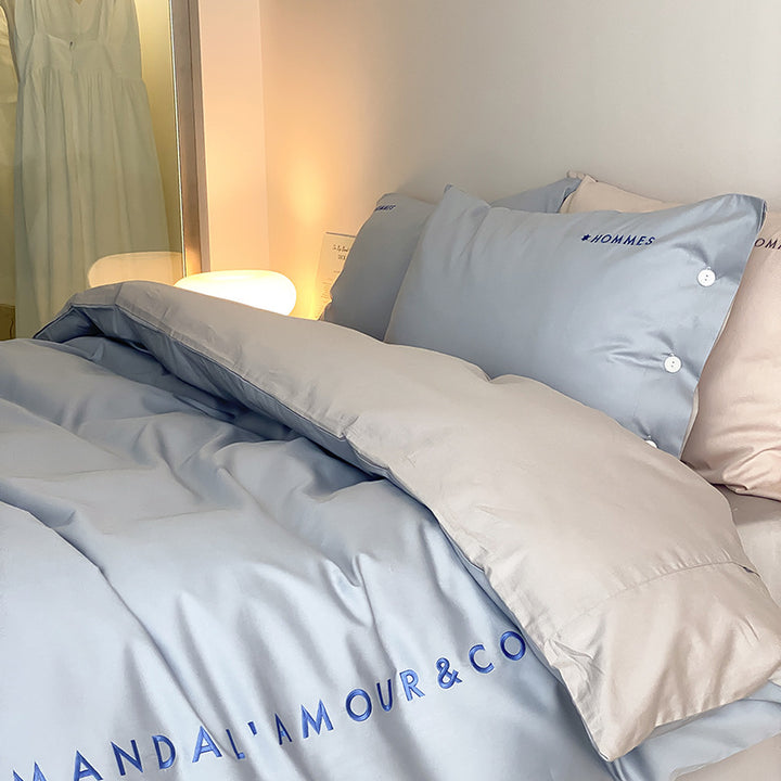 Luxurious cotton satin bedding set with embroidered brand logo and reversible function