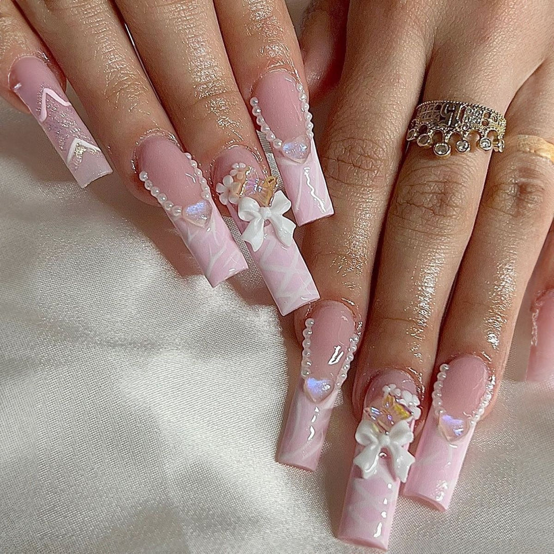 Creative acrylic nail set with delicate pearl and gloss accents Bowlift