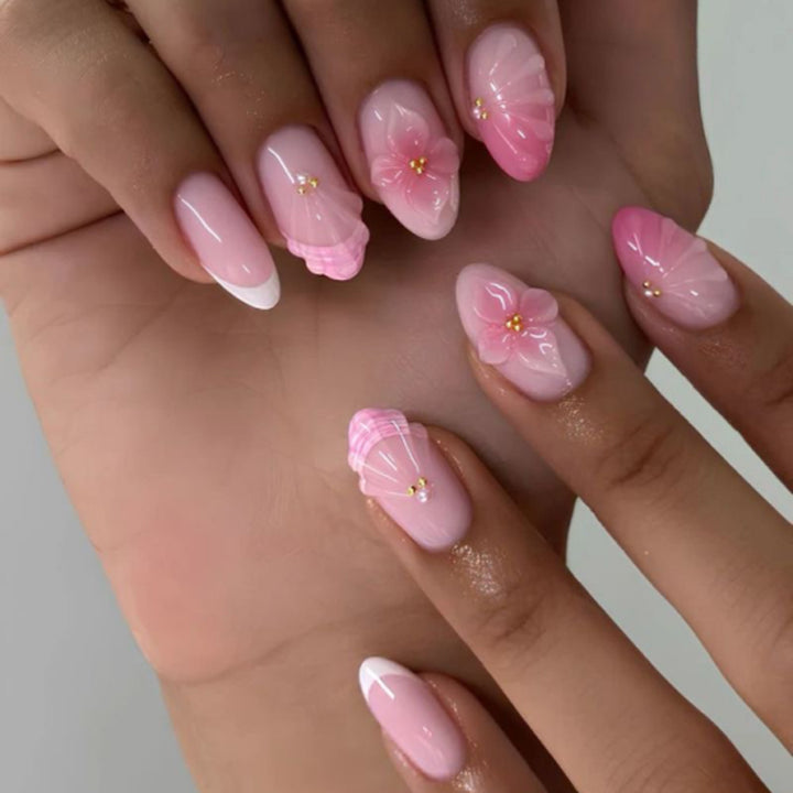 Artful stiletto nails with elegant floral design and glitter details Bowlift