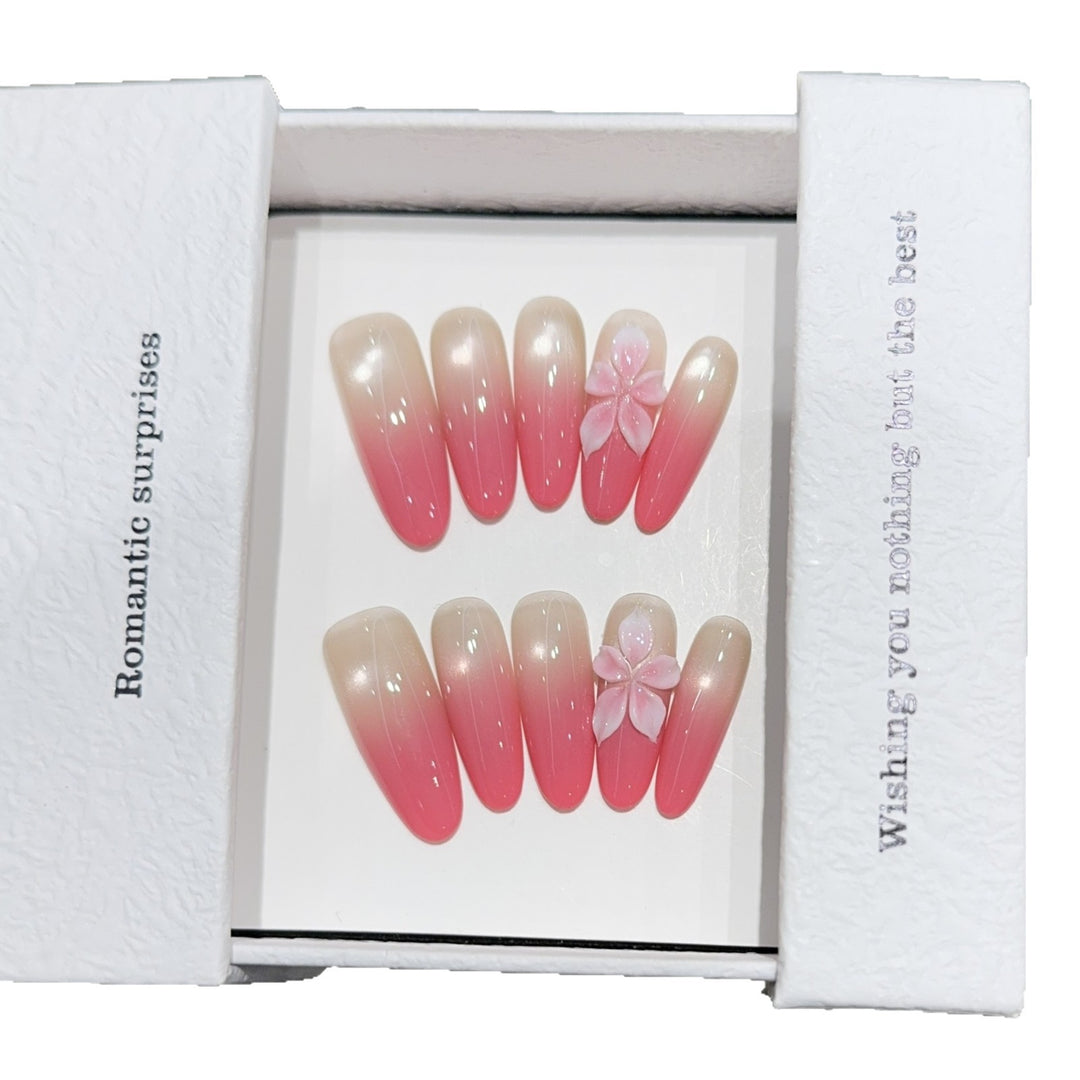 Artificial nails with romantic ombre design and floral accents Bowlift