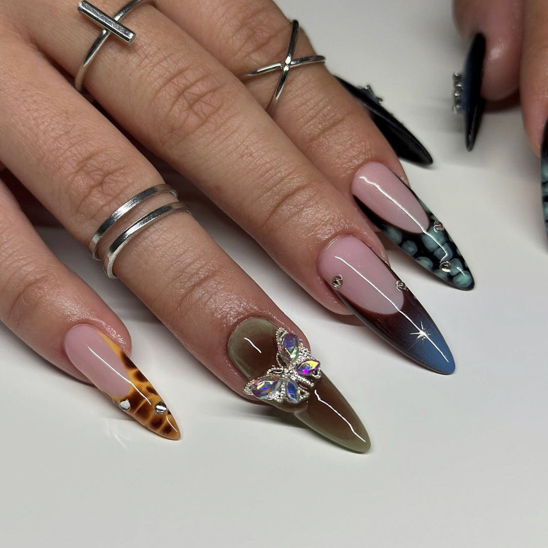 Artful nail extensions with elegant designs and glitter Bowlift