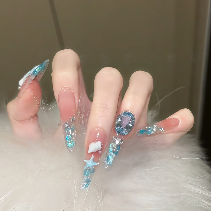 Creative artificial nails with maritime designs and sparkling accents Bowlift