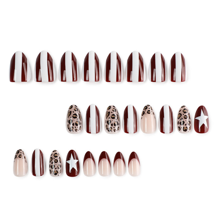 Artful stiletto nails with leopard pattern and elegant glitter decoration Bowlift