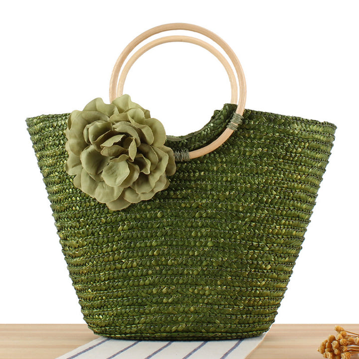 Braided straw bag with floral accent Bowlift