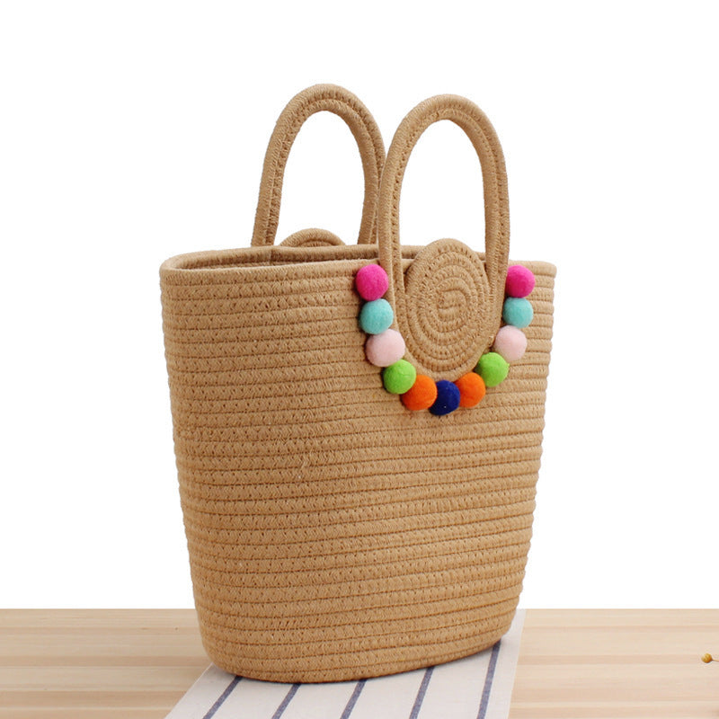 Playful beach bag with colorful pompom decor Bowlift