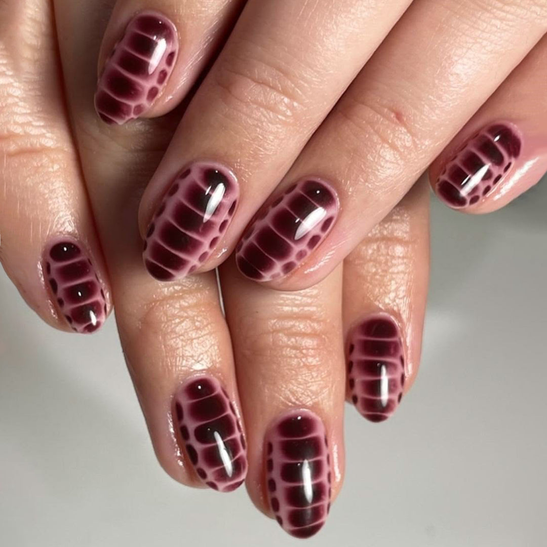 Artful nail art with snake motif Bowlift