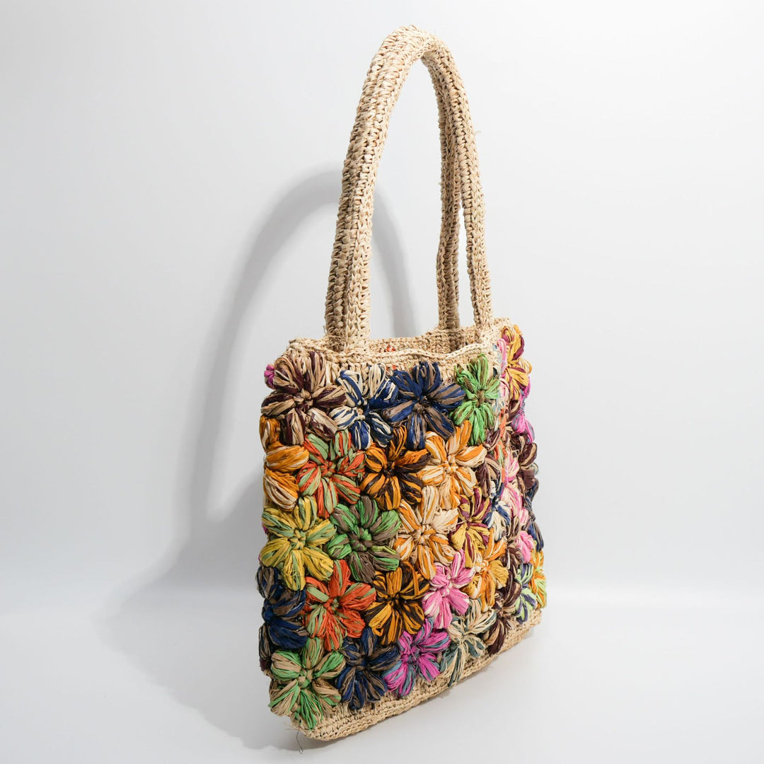 Handcrafted straw bag with floral appliqués Bowlift