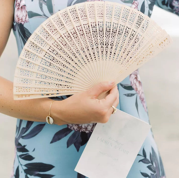Ladies fan made of delicate plastic with artistic cut pattern Bowlift