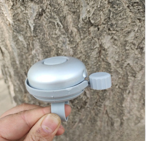 compact bicycle bell with quick-release handlebar mount Bowlift