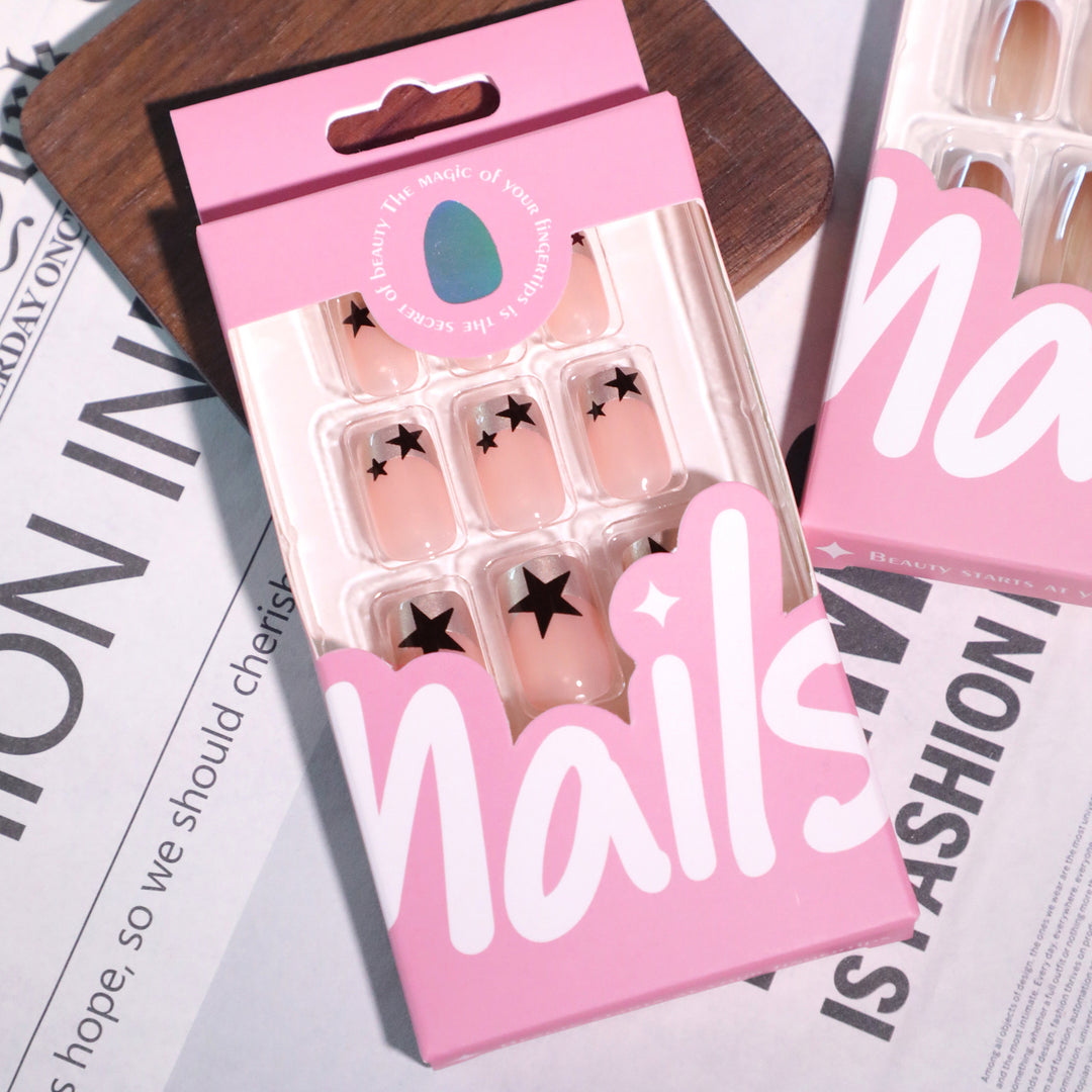 Sparkling nail art with stars and glitter accents Bowlift