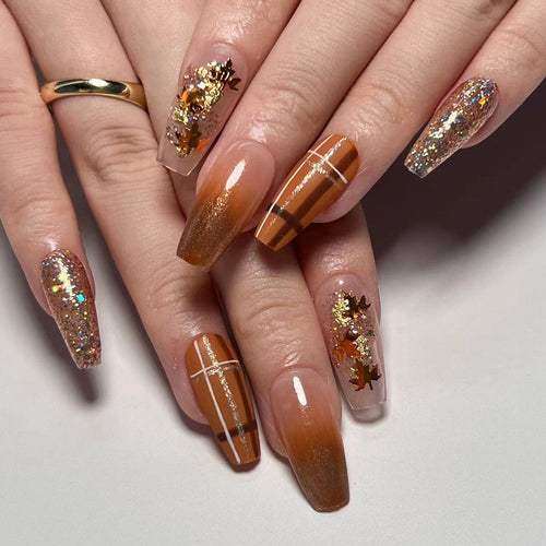 Artful nail extensions with glitter and leaf patterns Bowlift