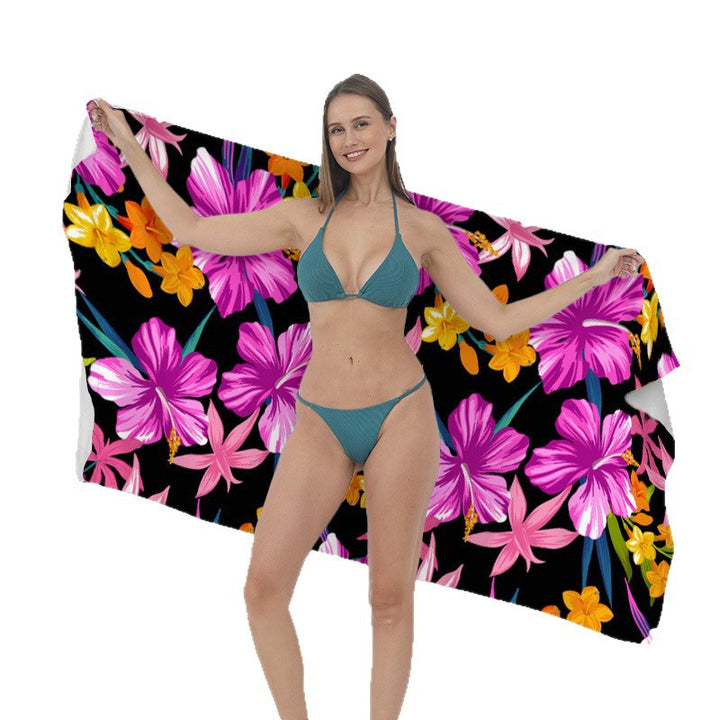 Beach towel with vibrant tropical plant motif Bowlift
