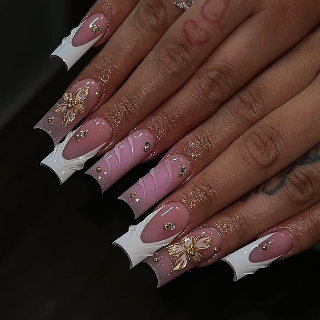 Glamorous gel nails with floral accent and glitter details Bowlift