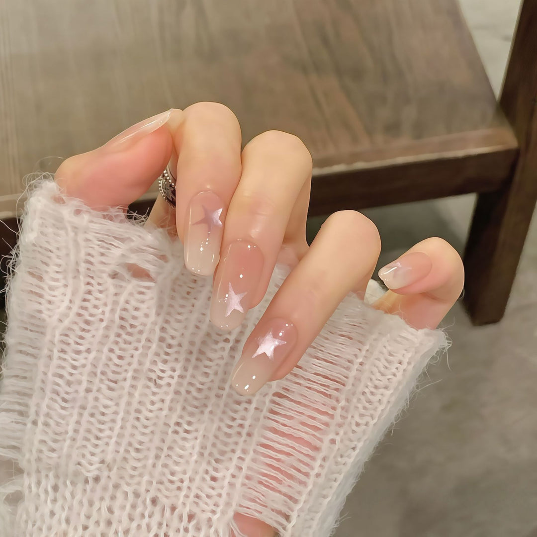 Artificial nails with sparkling stars and gentle gradient Bowlift