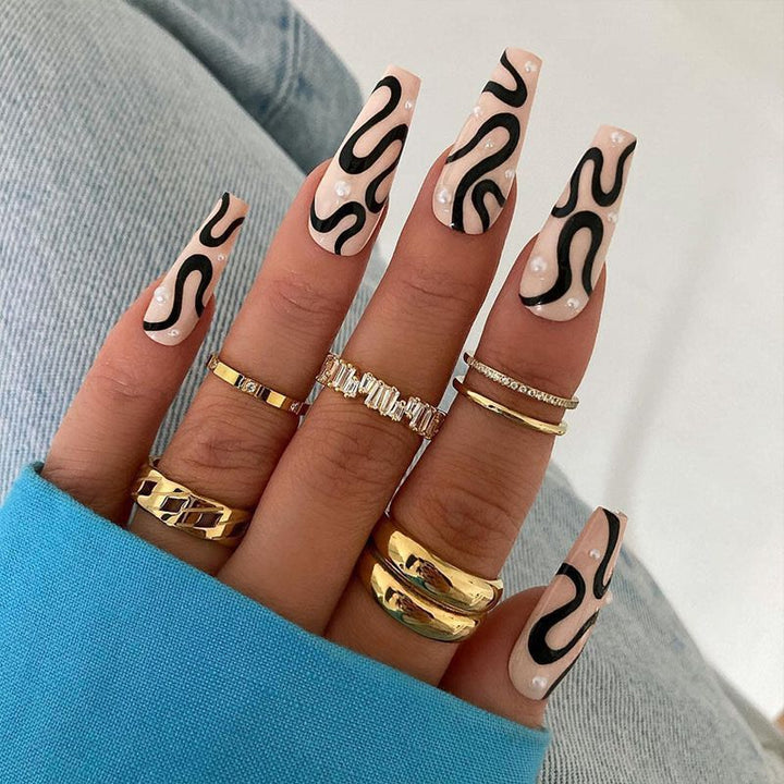 Artificial nail set with unique wave designs and glamorous accents Bowlift