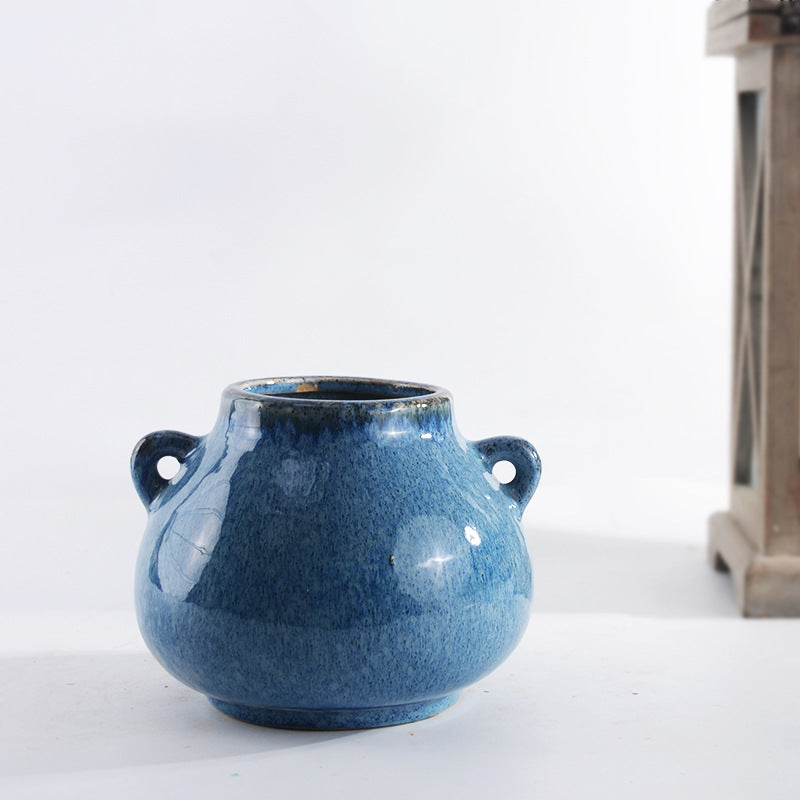 Decorative ceramic pot with playful handles Bowlift