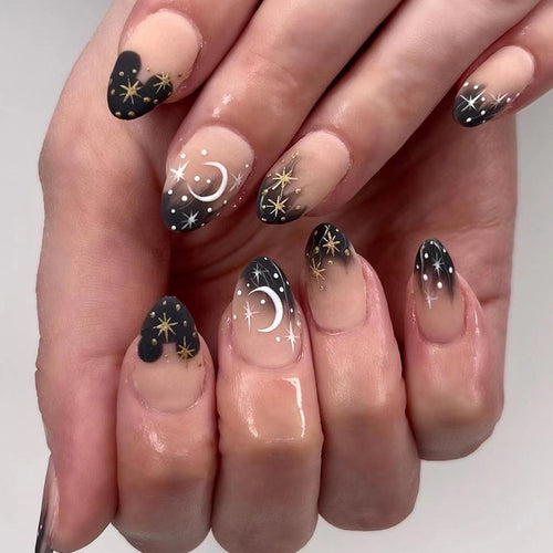 Artistic nail art with moon and star motifs Bowlift