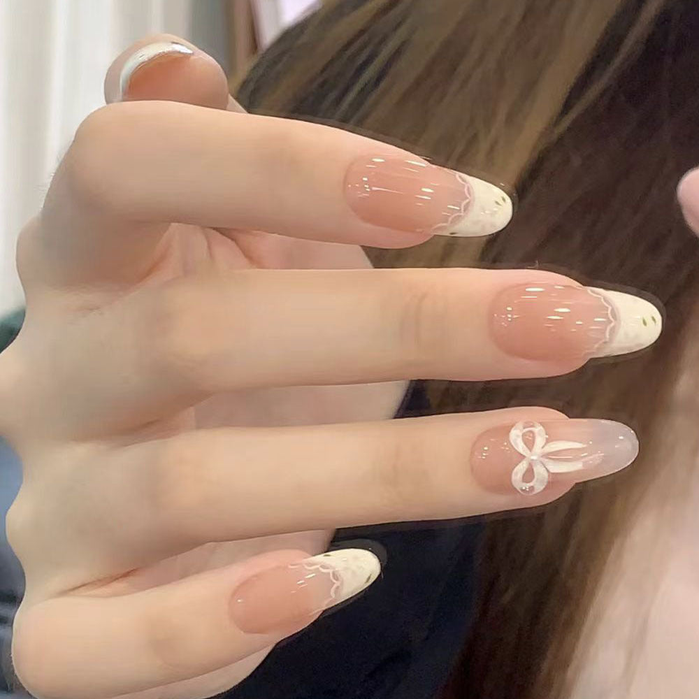 Artificial nails with elegant tip embellishment and romantic details Bowlift