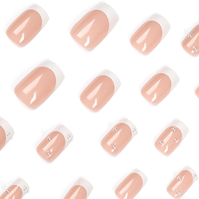 Artful nail art with elegant pearl and glitter accents Bowlift