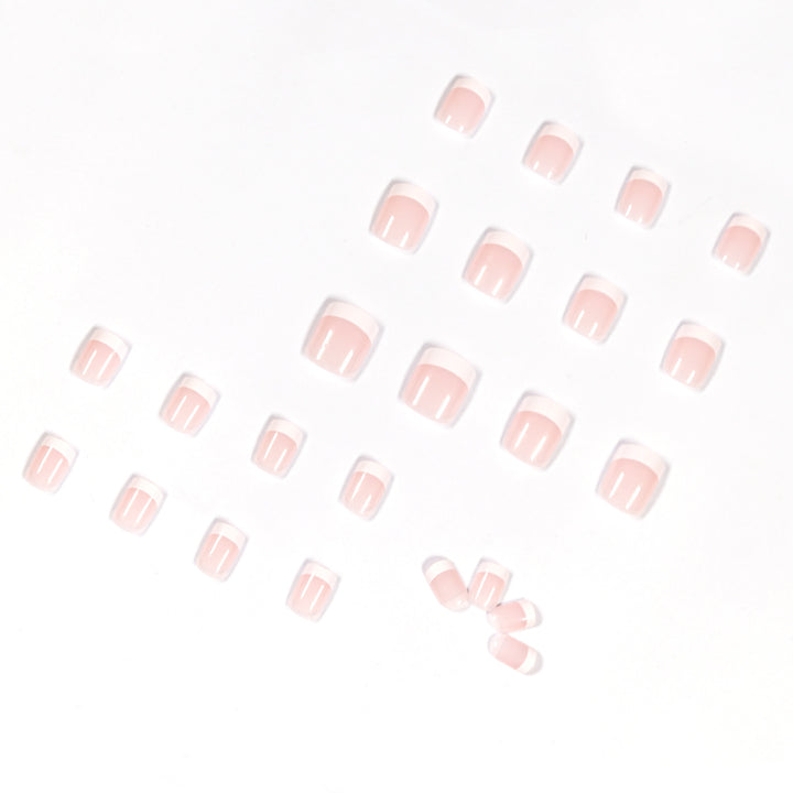 Artificial nails in French Tip design Bowlift