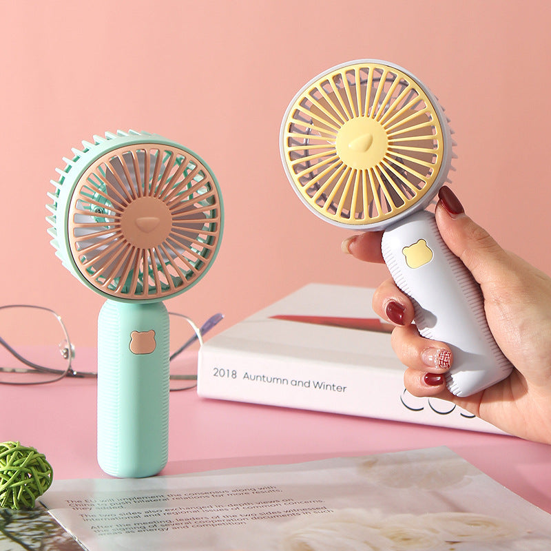 Ladies compact handheld fan with ergonomic grip, quiet brushless motor, and removable stand Bowlift