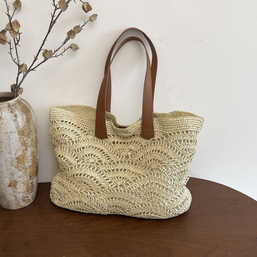 Handbag made of high-quality woven natural material with elegant leather handles Bowlift