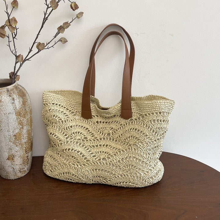 Handbag made of high-quality woven natural material with elegant leather handles Bowlift