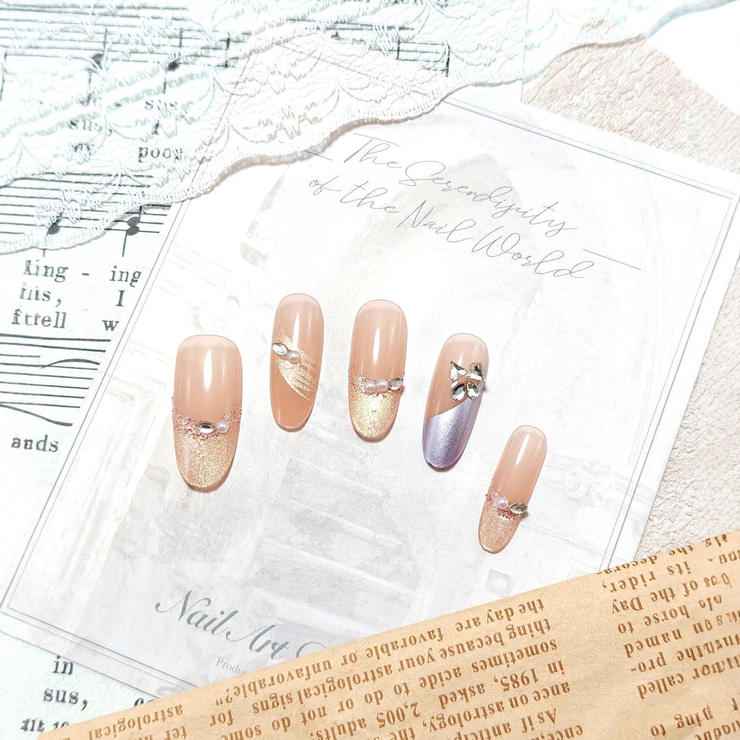 Glamorous artificial nails with rhinestone applications Bowlift