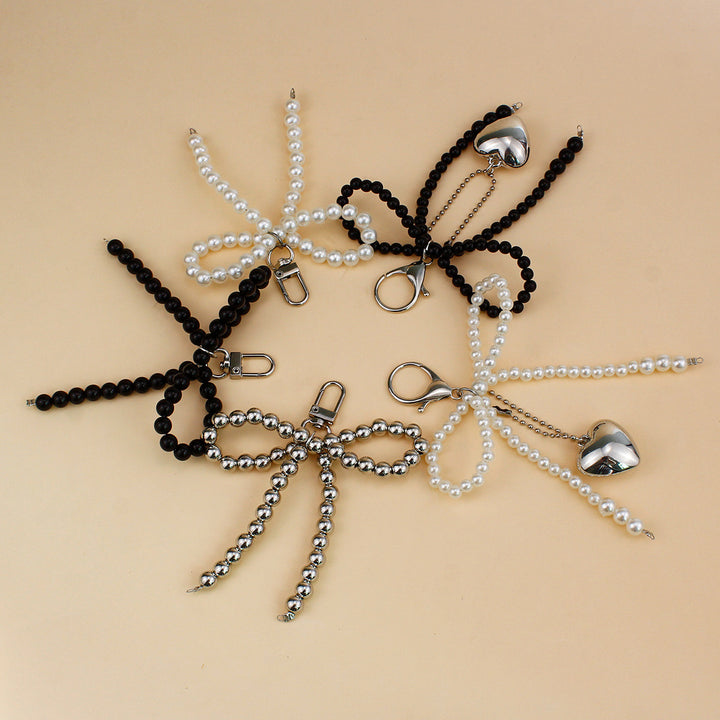 Elegant Pearl Bow Brooch Bowlift