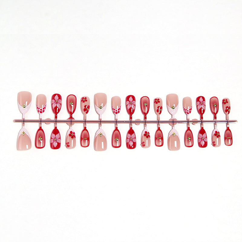 Artificial nails with floral design and glamorous accents Bowlift