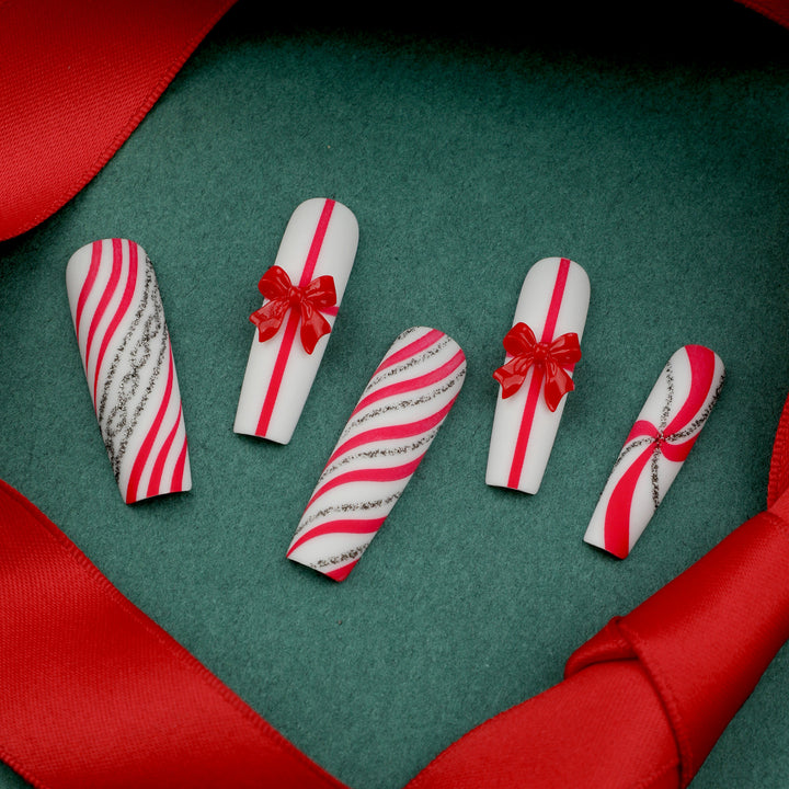 Artful Nail Art with Festive Bows and Christmas Motifs Bowlift