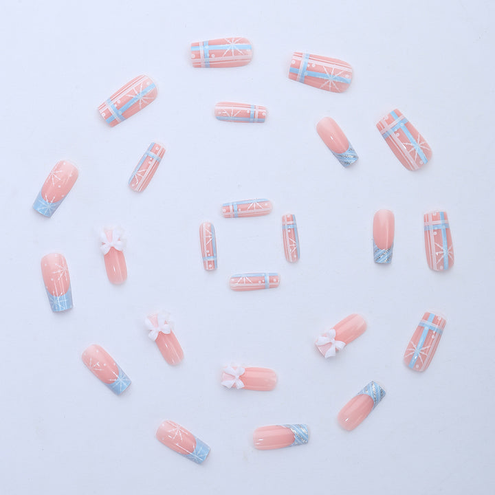 Artificial nail set with winter snowflake and bow motifs Bowlift