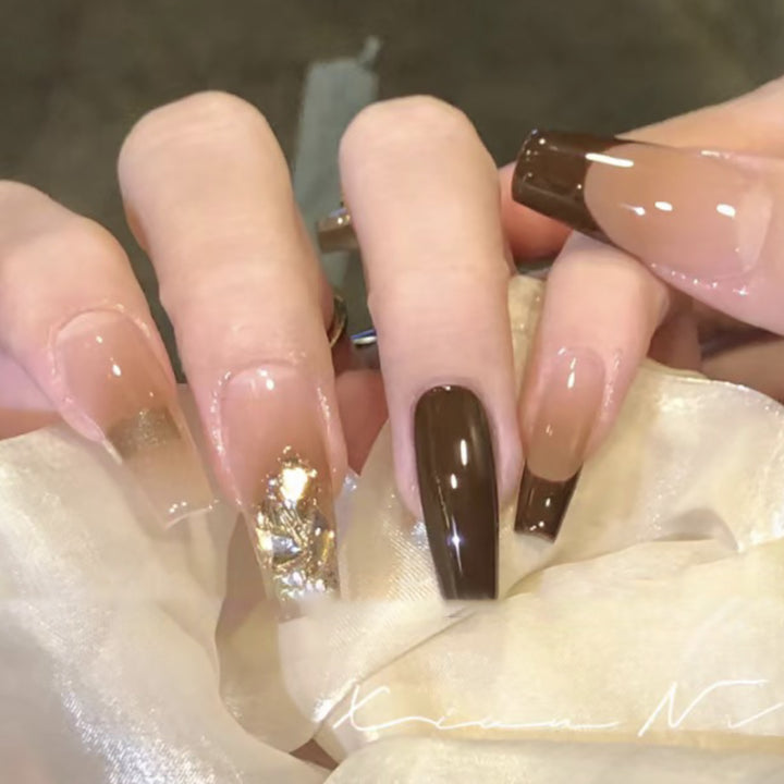 Elegant Long Press-On Nails with Decorative Gold Accents Bowlift