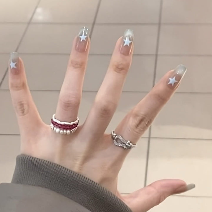 Artificial fingernails with star motif and ombre effect Bowlift