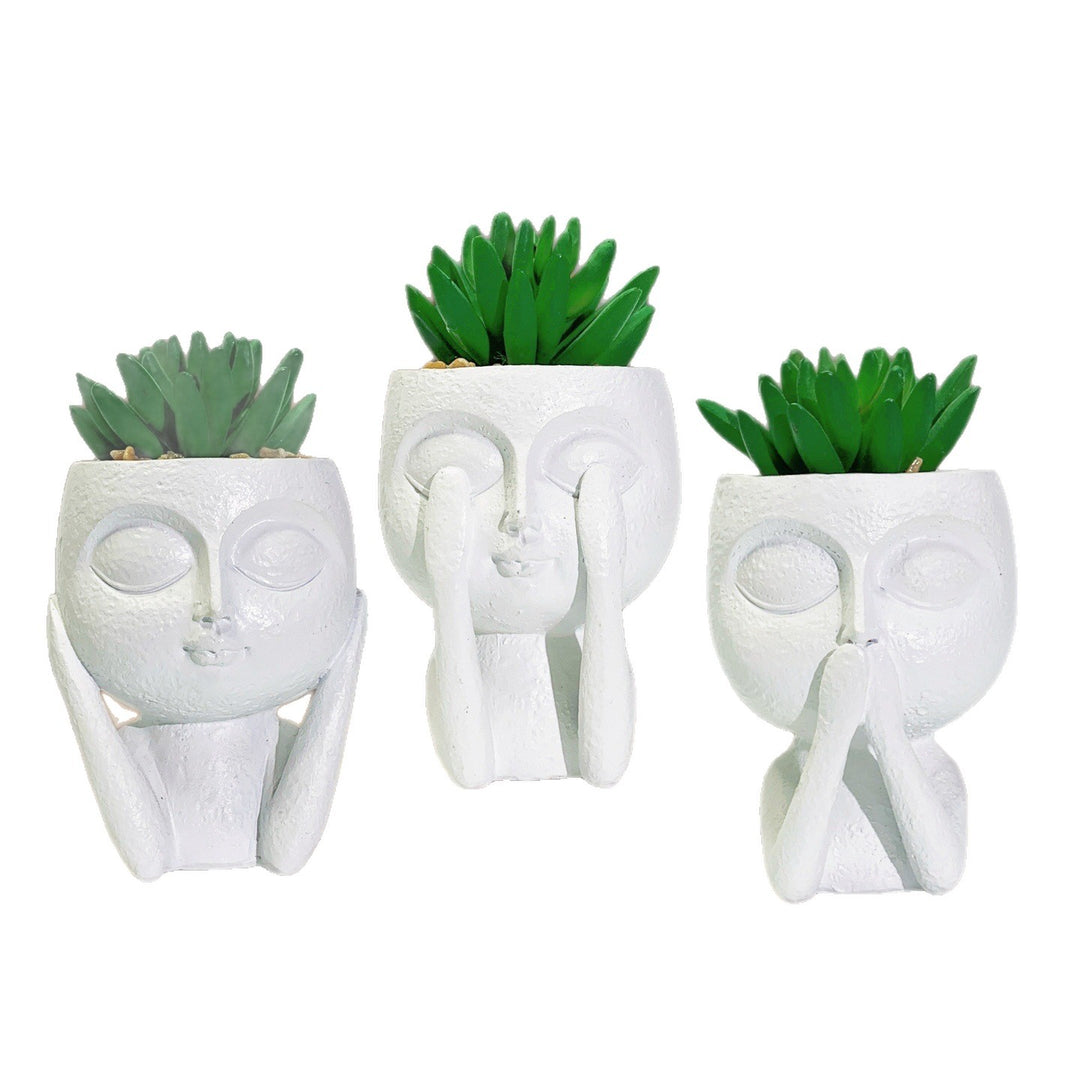 Plant pot with face motif Bowlift