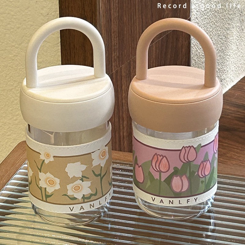 Women's insulated drinking bottle with ergonomic carrying handle and elegant flower design Bowlift