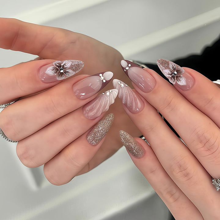 Artificial nail set with elegant flower and glitter accents Bowlift