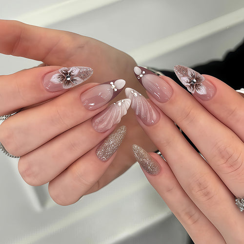 Artificial nail set with elegant flower and glitter accents Bowlift