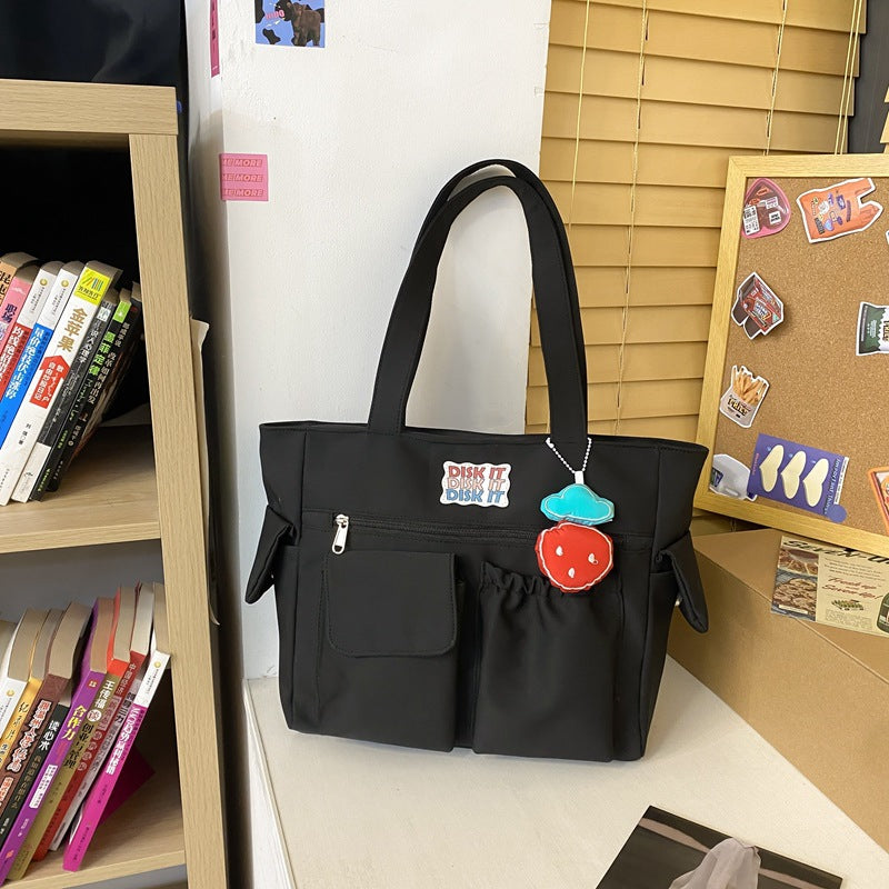 Tote bag with versatile compartments and ergonomic design Bowlift