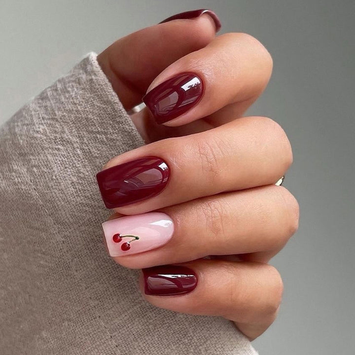Elegant Press-On Nail Set with Cherry Accent Design Bowlift