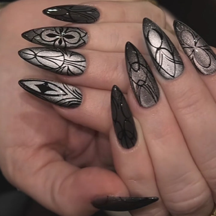 Acrylic nail set with creepy spider design and glitter accents Bowlift