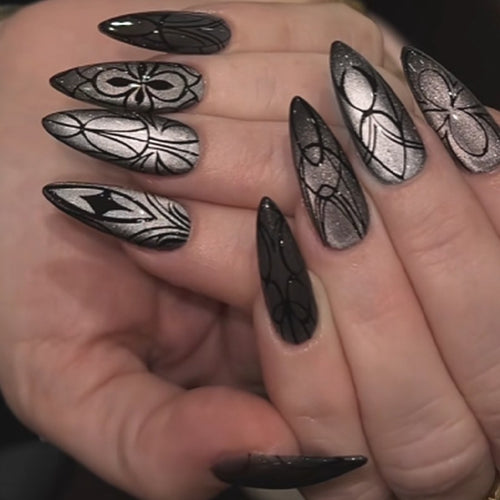 Acrylic nail set with creepy spider design and glitter accents Bowlift