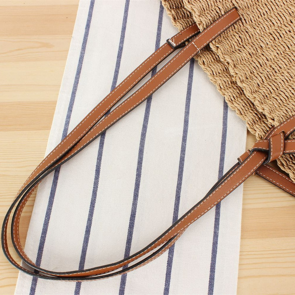 Beach bag made of handwoven natural material with sturdy leather straps Bowlift