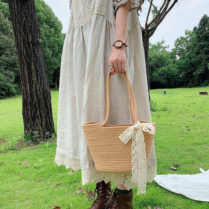 Elegant Bast Handbag with Lace Accent Bowlift