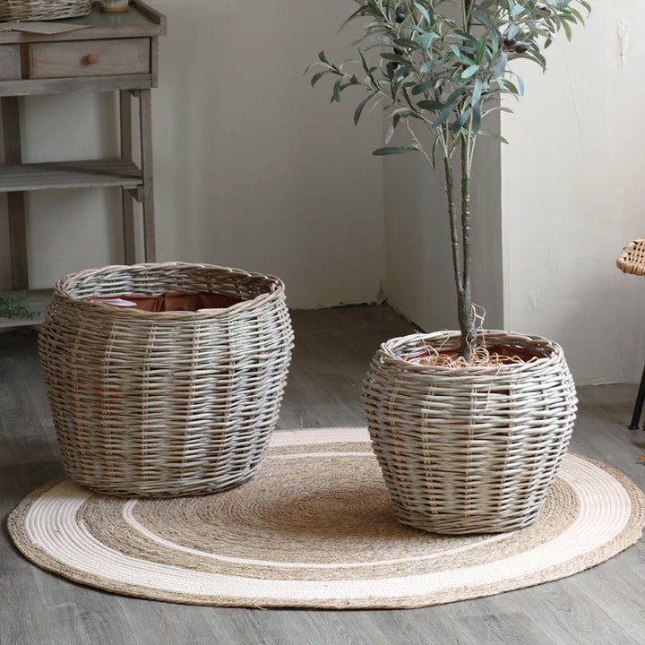 Stylish laundry basket made of braided natural material Bowlift