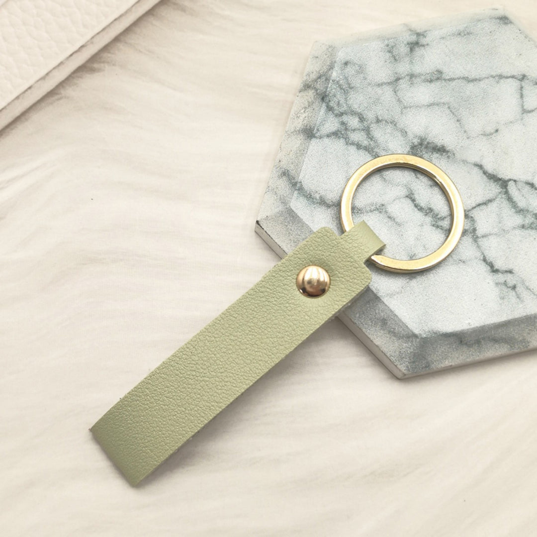 Unisex keychain made of high-quality synthetic leather with elegant metal embellishment Bowlift