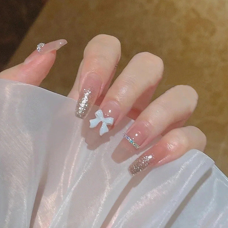 Artificial nails with heart and glitter accents Bowlift